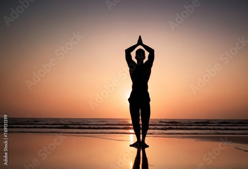 Silhouette of a man practicing yoga on the beach at sunset. Healthy lifestyle concept, poster, banner, copy space. © Plutmaverick