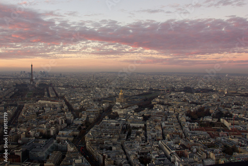 Aerial view, from Montparnasse tower at sunset and night sky, view of the Eiffel Tower and La Defense district in Paris, France