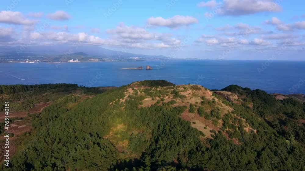 Aerial shot of Mt. Sanbangsan, a volcanic cone on Jeju Island, South Korea. Aerial shot of Mt. Sanbangsan, a volcanic cone on Jeju Island, South Korea.