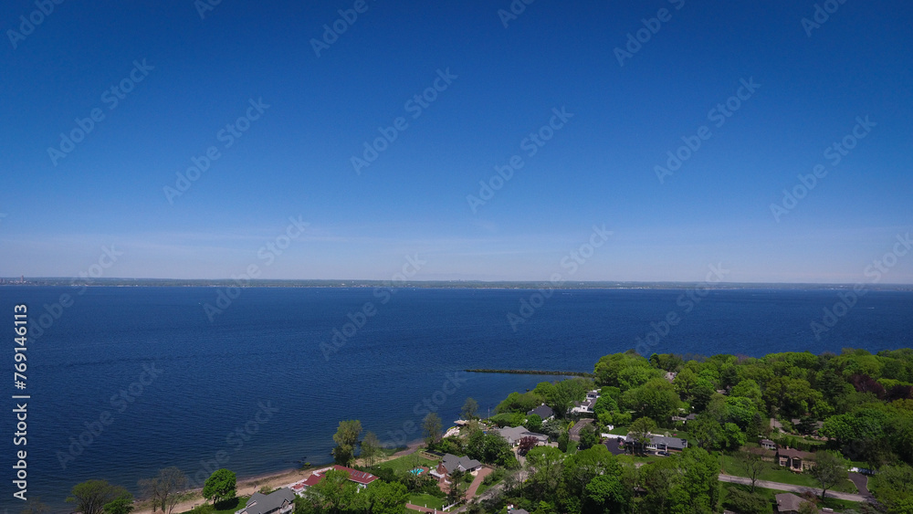 Aerial View of Clear Sky and Ocean, Green Treescape