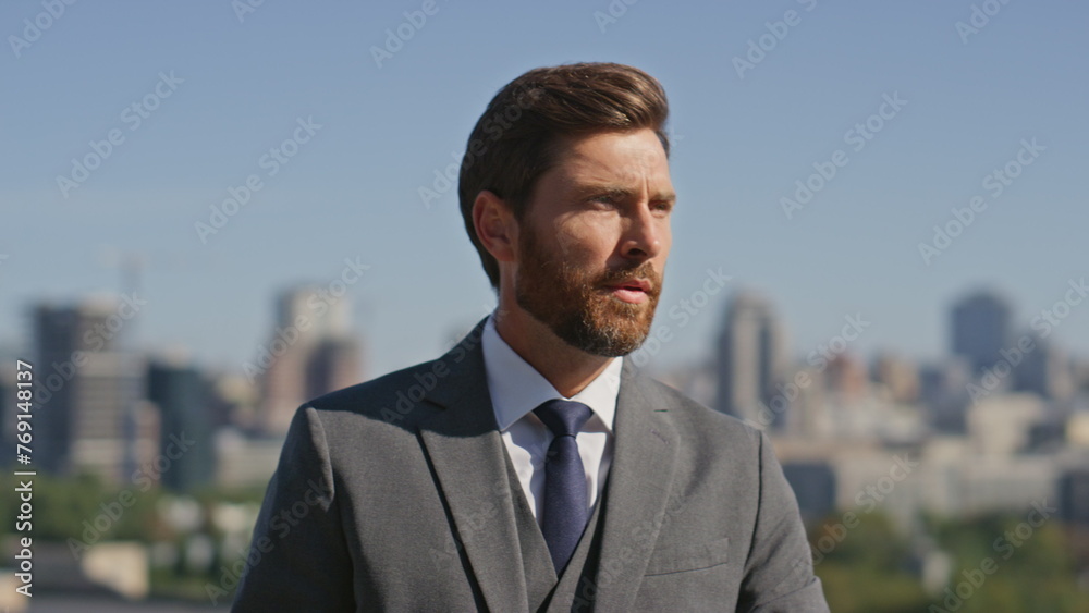 Confident gentleman posing street in elegant suit close up. Portrait businessman Confident gentleman posing street in elegant suit close up. Portrait businessman