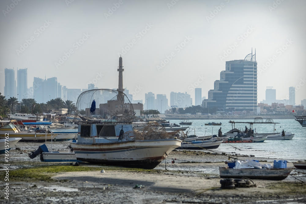 Boats and cityscpae view in the fisherman's bay in Manama Bahrain