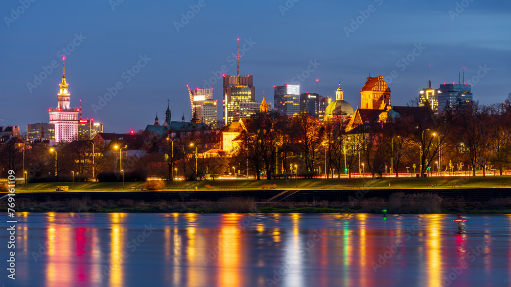 Warsaw, Poland - panorama of a city skyline at blue hour. Cityscape view of Warsaw with Old Town , skyscrapers in downtown and Vistula river Capital of Poland