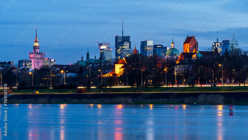 Fototapeta premium Warsaw, Poland - panorama of a city skyline at blue hour. Cityscape view of Warsaw with Old Town , skyscrapers in downtown and Vistula river Capital of Poland