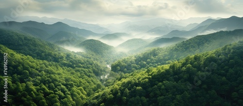 The serene image captures a picturesque valley with a meandering river cutting through the green landscape