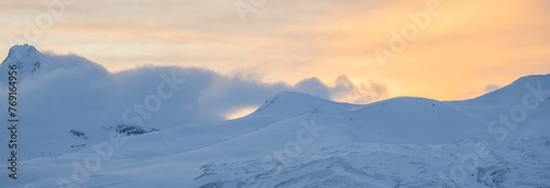 Cloud covered snowy mountains, natural scene © Daniel