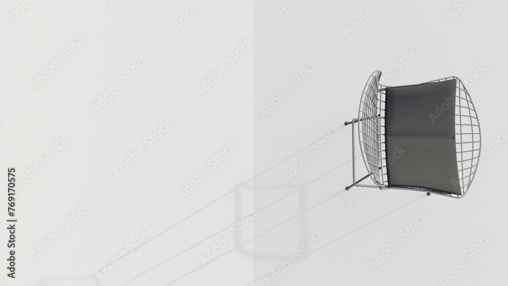 A white chair with a black cushion sits on a white wall A white chair with a black cushion sits on a white wall