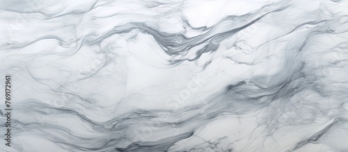 A closeup of a textured white marble surface resembling frozen liquid. The grey swirls create a sense of movement, like wind waves on snowcovered slopes. The freezing cold mimics an ice cap