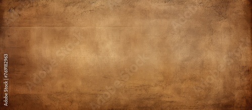 A detailed close-up of a textured brown background, displaying a rough and grungy surface with a variety of earthy tones and uneven patterns