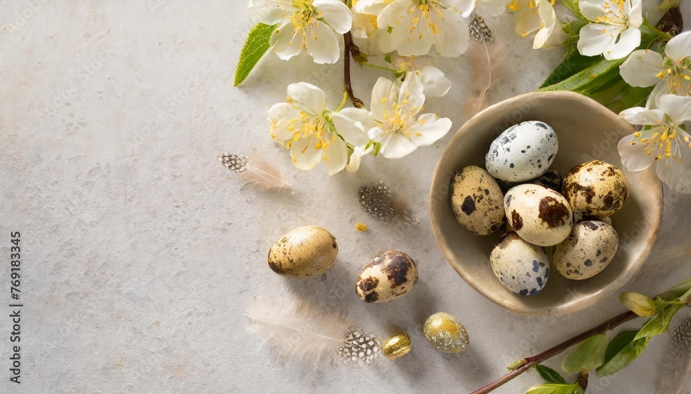 easter quail eggs and springtime flowers over white background spring holidays concept with copy space top view