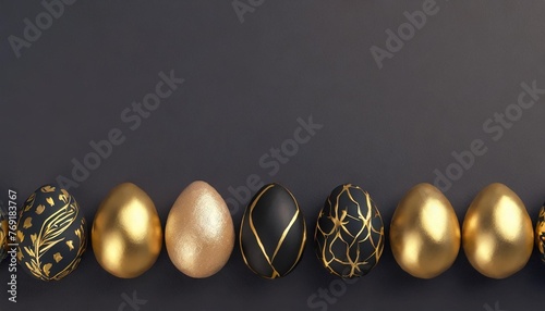 easter eggs lying in a row with black and gold decor against a plain background flat lay top view banner card with place for text religious holiday free copy space illustration photo