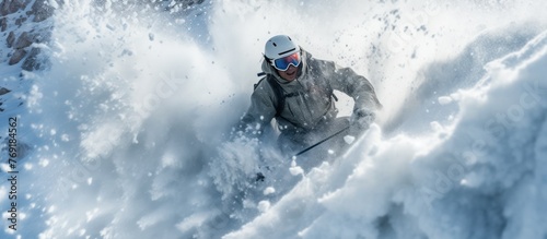 view of a snowboarder sliding through a snow cliff