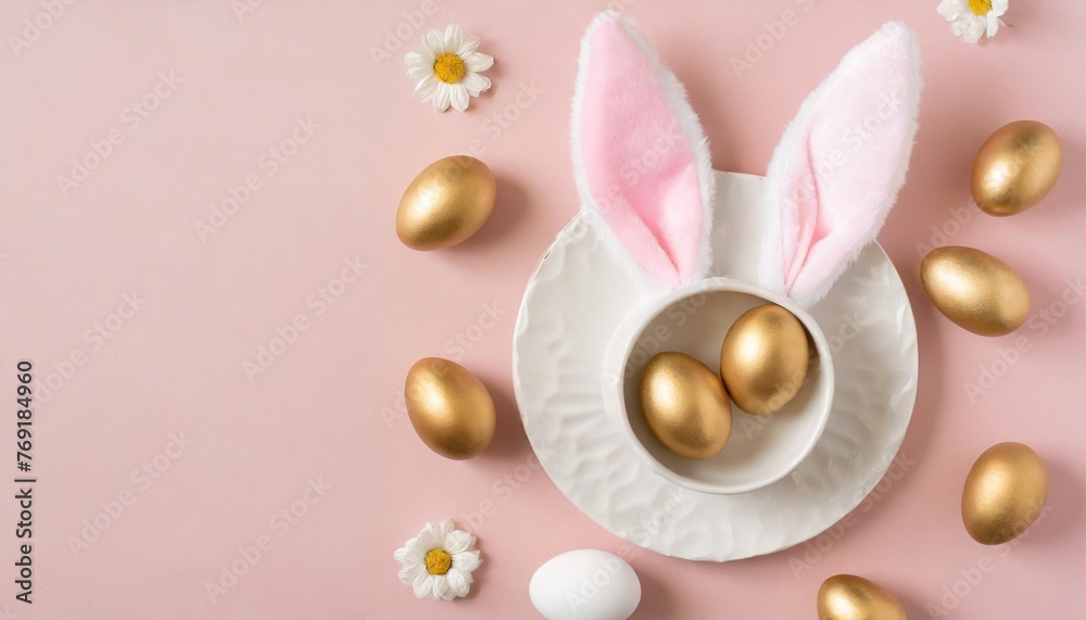 easter decor concept top view photo of easter bunny ears on white circle white and golden eggs on isolated pastel pink background with copyspace