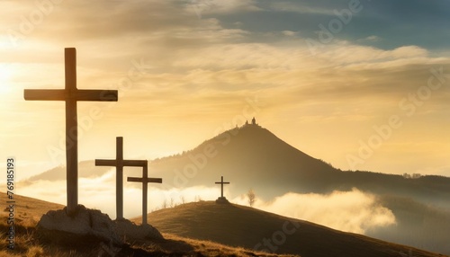 christian easter scene he is risen mount calvary and three silhouettes of crosses at sunrise banner for easter photo