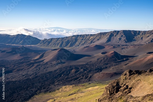 Looking down into the crater of Haleakal   Volcano  or the East Maui Volcano  which is a massive shield volcano that forms more than 75  of the Hawaiian Island of Maui. 