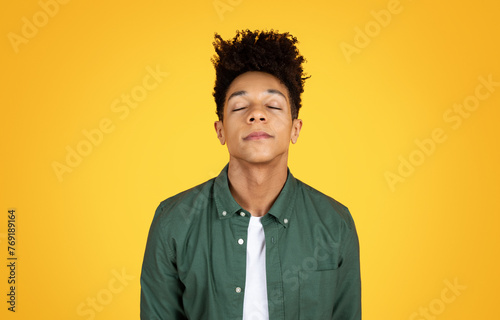 Young black man with closed eyes, peaceful