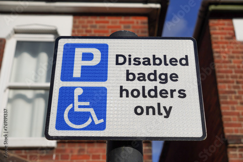 Disabled badge holders only sign for parking space in the UK. 