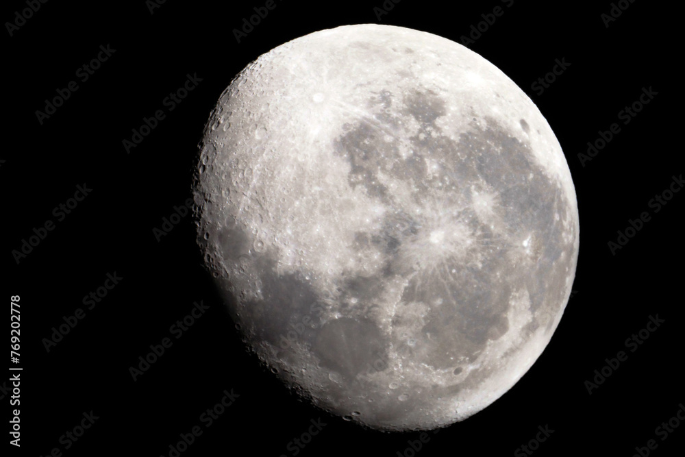 Fototapeta premium The moon is 17 days old and is in the waning gibbous phase of its lunar cycle. It is 95% illuminated