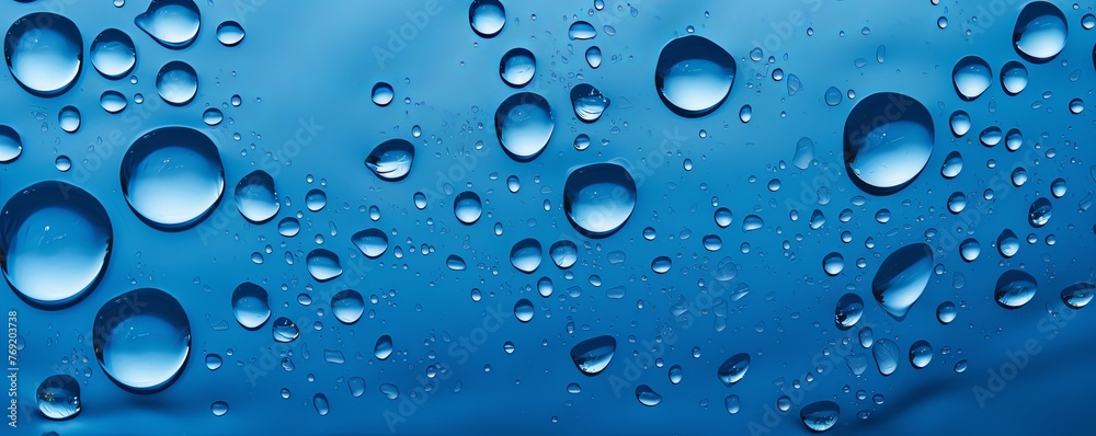 water droplets on all blue, matte background
