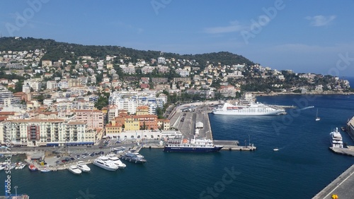 View of the port of Nice baie des anges , Colorful houses in the city of Nice on the french riviera in South East of France with a lot of boats in the harbour. © Hocineharoun