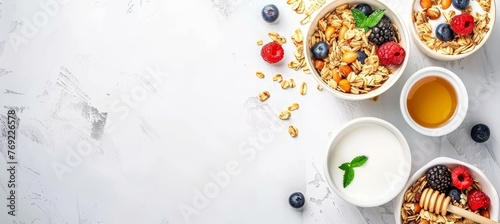 Healthy american breakfast with granola, milk, berries, and honey on bright white background