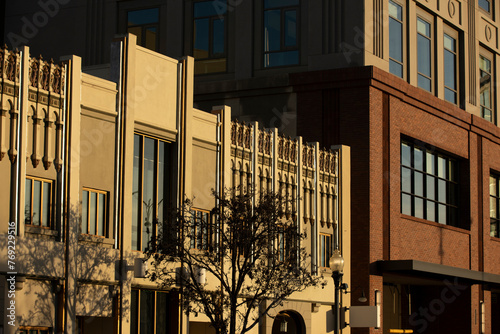 Sunlight light shines on historic downtown buildings of Redwood City, California, USA. photo