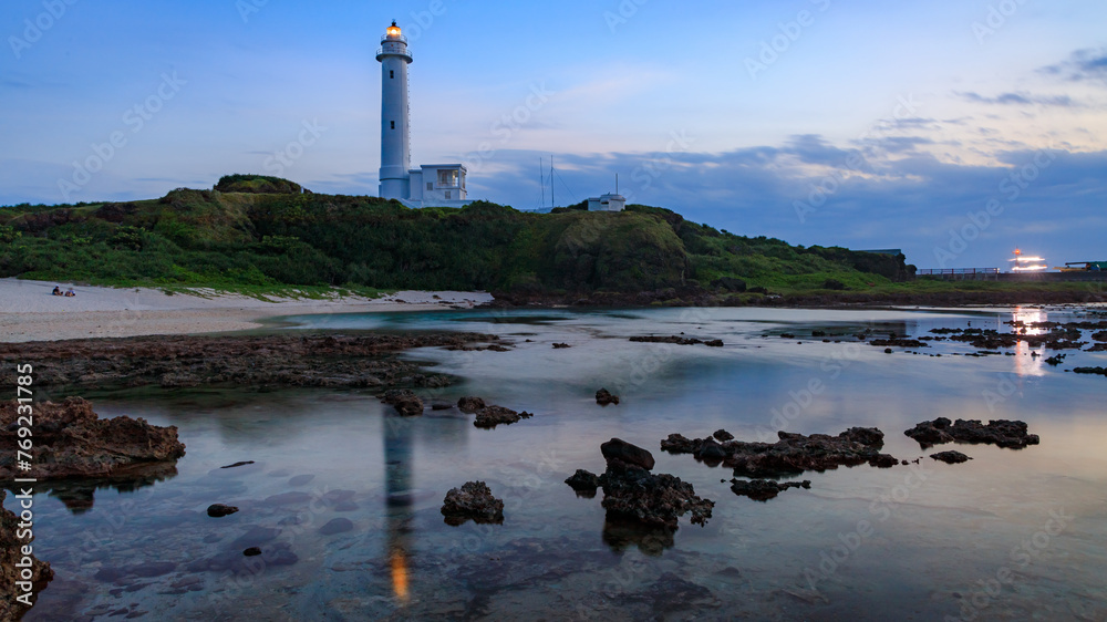 Evening landscape of a coral reef beach after sunset in late summer around the lighthouse of Green Island (Lyudao), an outlying island in southeastern Taiwan.