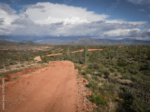 Wide shot of Four wheel drive road in Cave Creek Arizona desert in Tonto national Forest with stormy sky