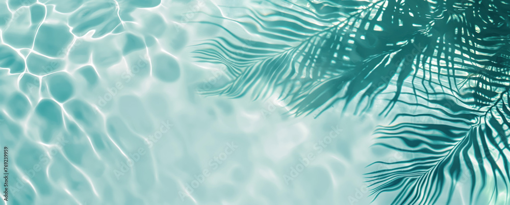 Summer vacation and travel concept. Shadow of a palm tree on water. Empty space for advertisement 