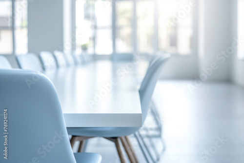 High level modern white meeting room is decorated with stylish table and chairs around. 