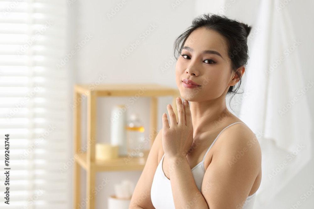Portrait of beautiful woman with perfect skin indoors, space for text Portrait of beautiful woman with perfect skin indoors, space for text