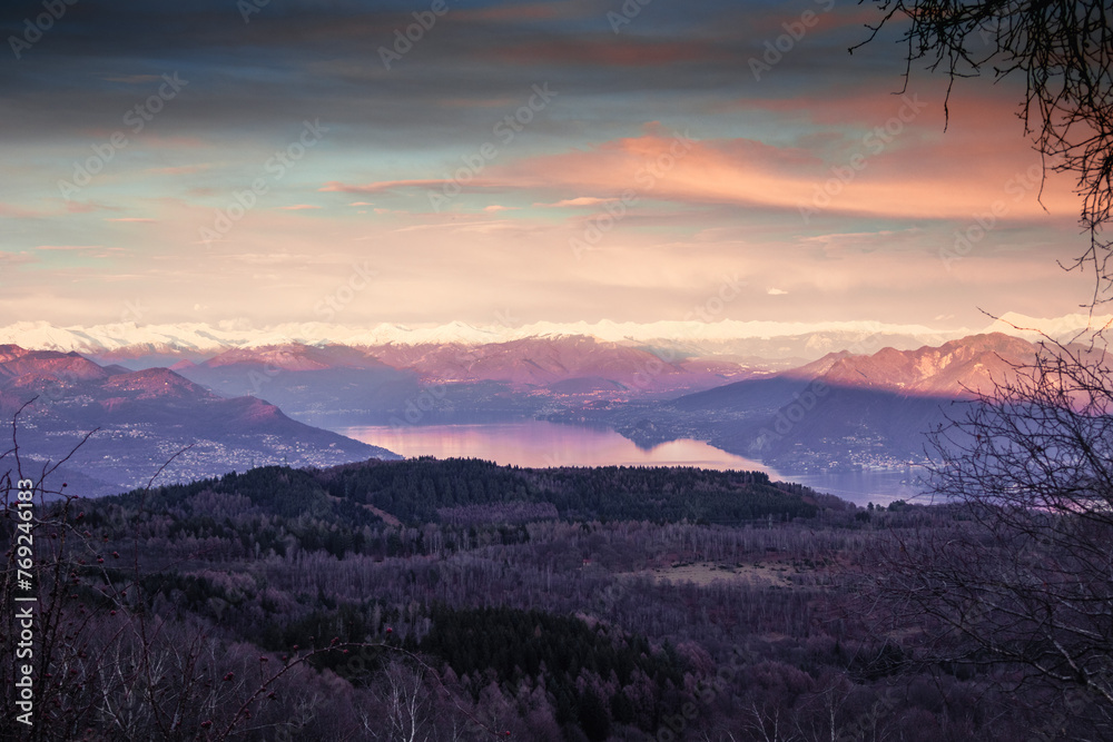Naklejka premium Sunset in the snowed mountain, pink lights on the lake. Swiss Alps, after snowfall, seen from Mottarone mountain (Stresa side). Piedmont - Italy.