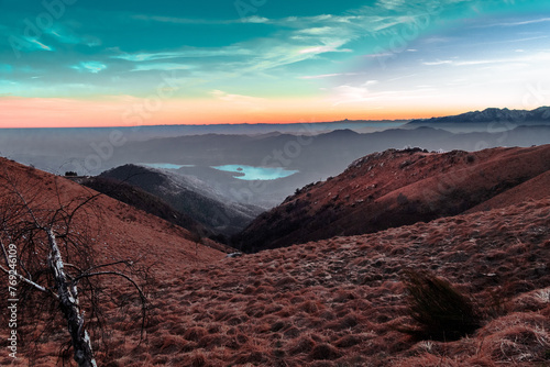 Above the mountains. Lake Orta and mountain range in the background, in fantasy colors.