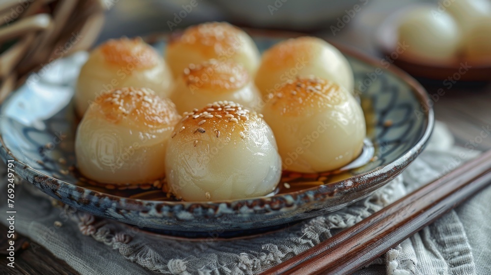 Mochi is a rice cake made from glutinous rice pounded into a sticky, chewy consistency. It's often filled with sweet or savory fillings and served as a delicacy or snack.
Mochi is a rice cake made from glutinous rice pounded into a sticky, chewy consistency. It's often filled with sweet or savory fillings and served as a delicacy or snack.