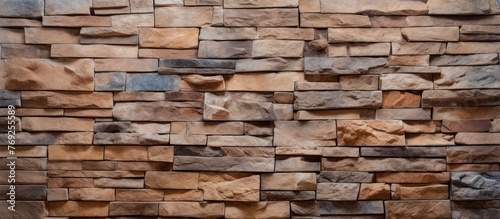 Detailed view of a sturdy wall constructed with individual stone blocks  showcasing rustic textures and earthy tones