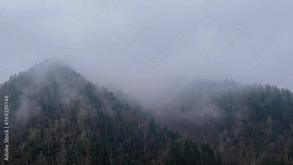 Time-lapse video of morning mist in the mountain forest. Fog is floating over the forested hills in Altai. Time-lapse video of morning mist in the mountain forest. Fog is floating over the forested hills in Altai.
