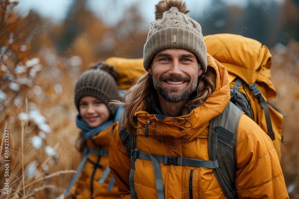 A man leading a child on an autumn hike, surrounded by golden foliage and cool weather attire