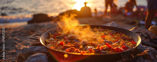 Sunset paella cooking on the beach friends gathering