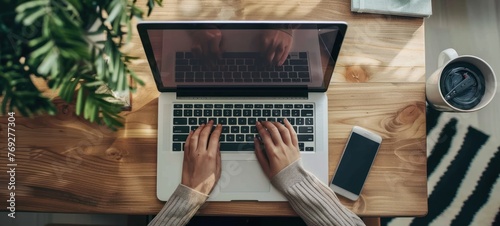 Hands typing on laptop keyboard. social distancing working from home photo