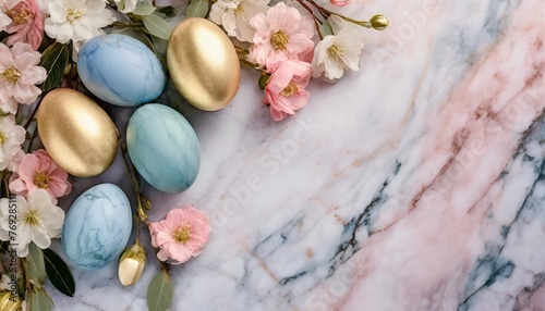 stylish easter eggs and spring flowers border on pink marble textured flat lay space for text modern natural dyed blue and marble easter eggs happy easter greeting card template with copy space