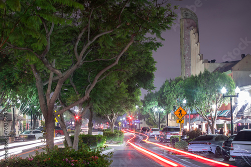 Inglewood, California, USA - October 7, 2022: Evening traffic passes through historic downtown Inglewood.