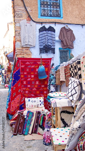 Colorful textiles for sale in the medina in Chefchaouen, Morocco © Angela