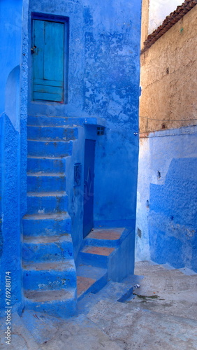 Blue steps leading to a blue doorway in the medina in Chefchaouen, Morocco © Angela