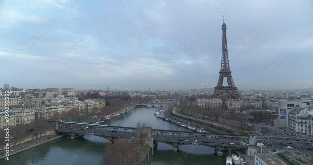 Drone shot of Paris Eiffel Tower with Subway passing by
