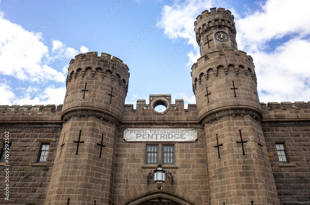 Facade of Pentridge Prison, with iconic bluestone towers and Gothic-inspired heritage architecture, the building is a local landmark of Australia's historical penal system. Coburg Melbourne  Australia