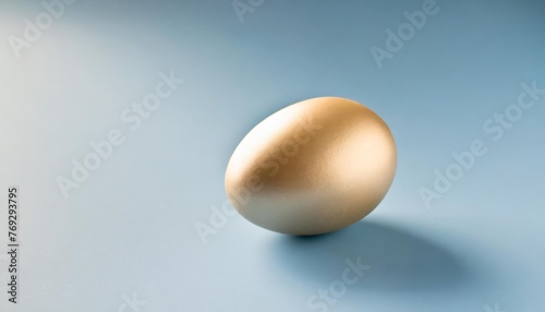 one pastel colored easter eggs on a isolated blue background