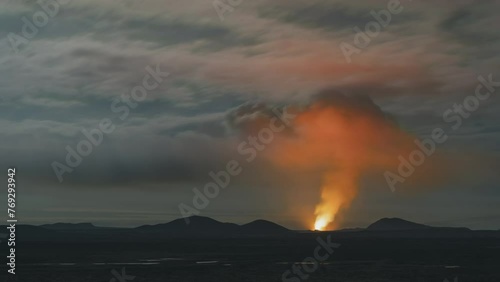 Volcanic activity on the new eruption site near Grindavik, lava glowing through smoke photo