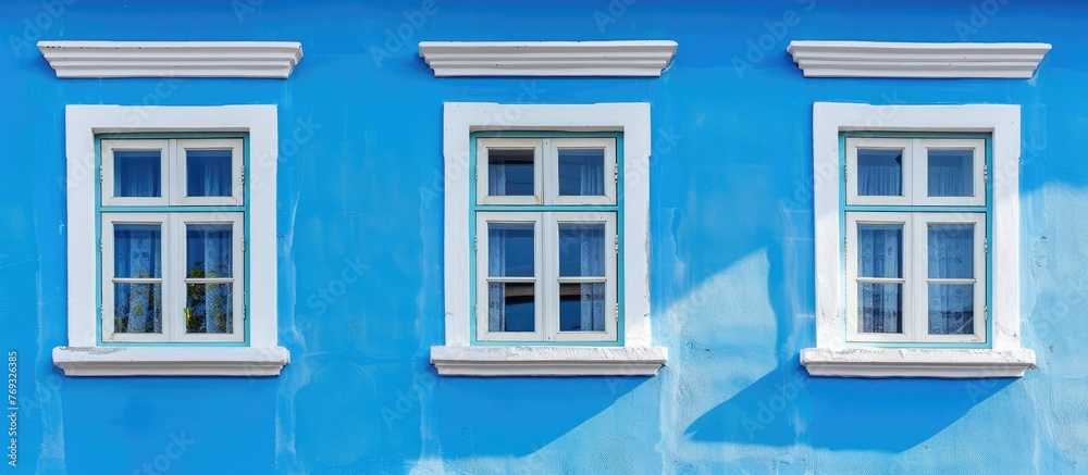 windows on a wall with blue background