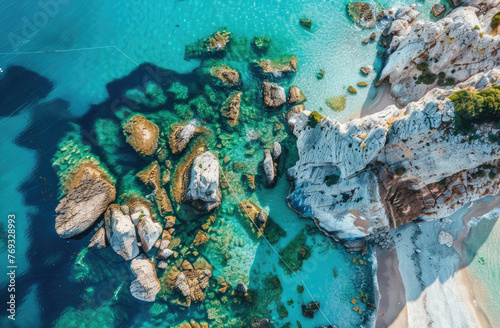 Aerial view of the white rocks at Sphagedon beach in Greece  capturing its unique and beautiful landscape with turquoise water. The crystal clear waters create stunning reflections on the rocks