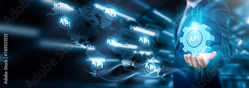 Businessman holding global API connections in digital networking and cloud data analytics, Business strategy and innovation implementation, customer engagement, technology, and global integration.